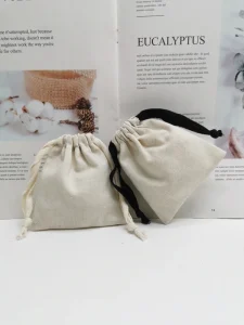 Benutzerdefinierte recycelbare Baumwoll-Canvas-Zugbeutel mit Siebdrucklogo für Schmuckverpackung Made in China