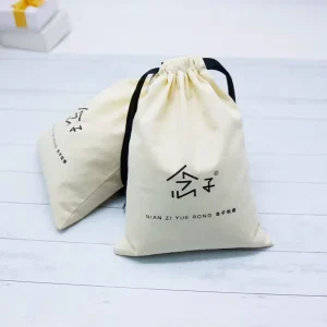 로고가 있는 노란색 유기농 면 가방, 로고가 있는 먼지 포장 파우치