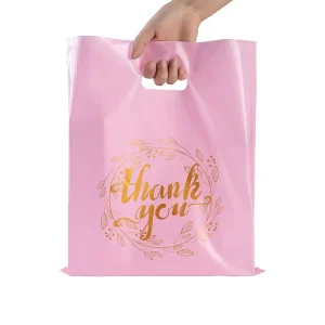 ロゴ入りカスタムバッグ プラスチック防水布 小売用ピンクショッピングバッグ 印刷済みダイカットプラスチックショッピングバッグ ハンドル付き