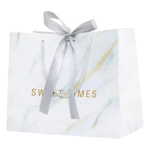 Bolsas de regalo de cartón impreso de lujo personalizadas con su propio logo para embalaje de ropa y joyería
